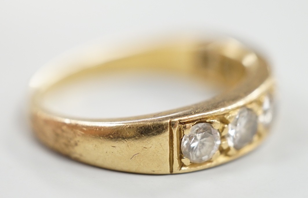 A modern 18ct gold and seven stone diamond set half hoop ring, size P, gross weight 5.3 grams.